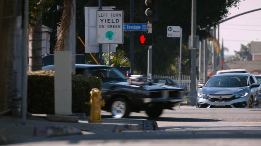 Black Charger taking a corner outside the Chinatown Crew Warehouse.