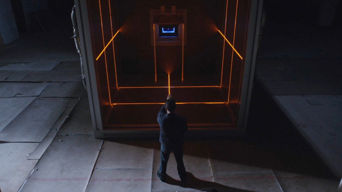 Eli standing by the Quantum Cube.