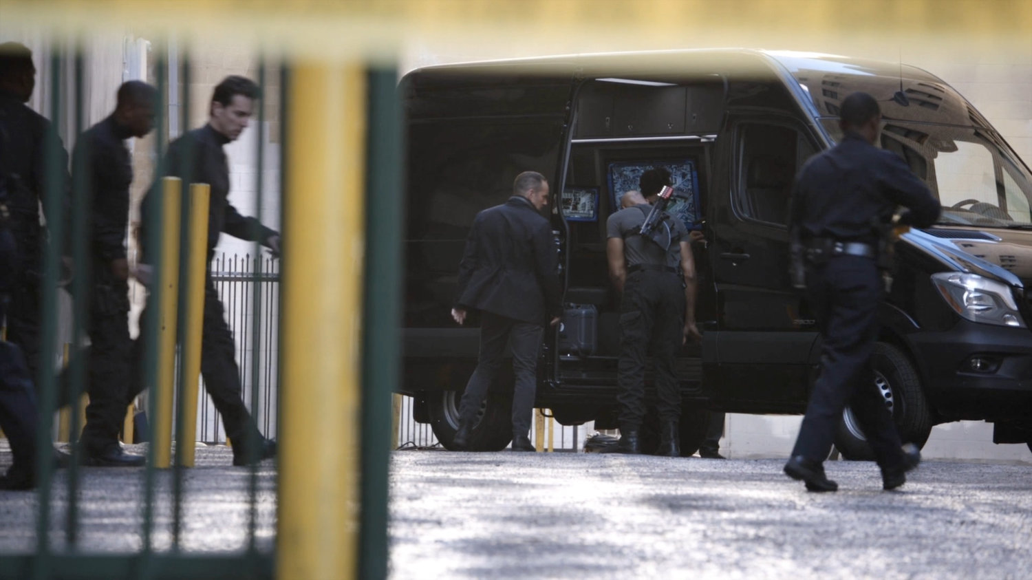 Coulson and Mack by a SHIELD van outside the Quantum Cube warehouse.