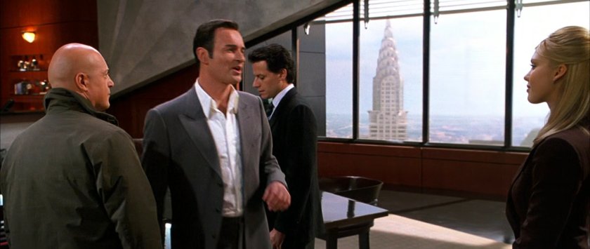 Reed, Ben, Victor and Sue in the boardroom of Von Doom Industries.