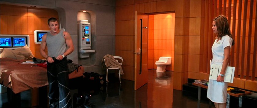 Johnny and a nurse in his room at the Von Doom compound.