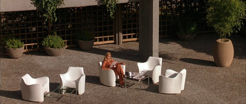 Sue sitting on a patio at the Von Doom compound.