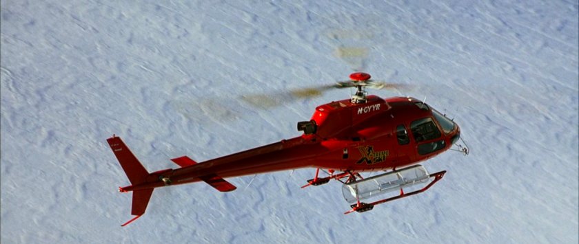 A helicopter over the snowy mountains near the Von Doom compound.