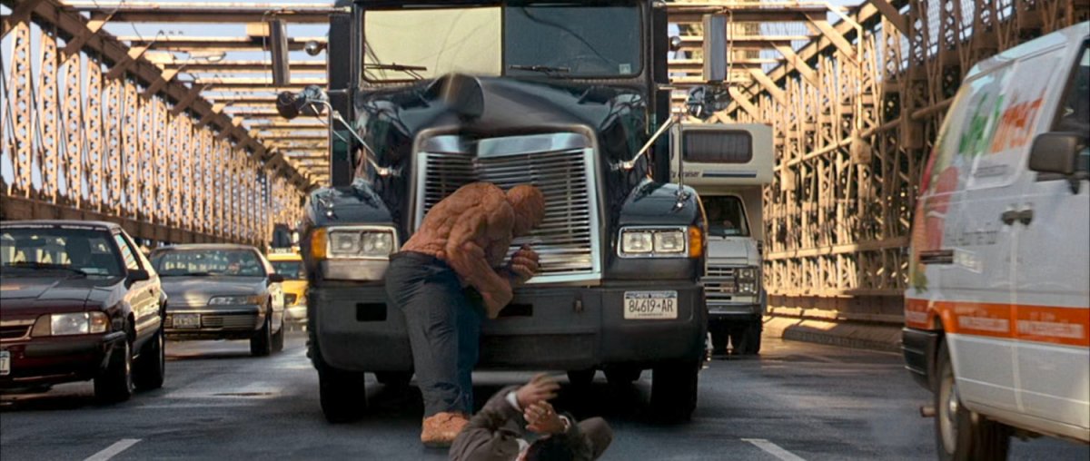 Ben standing in front of truck on Brooklyn Bridge.