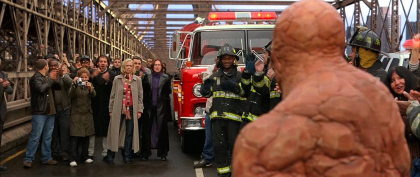 Ben with a crowd of onlookers on the Brooklyn Bridge.