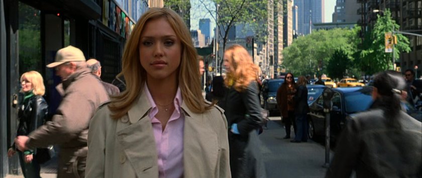 Sue walking along a New York sidewalk.