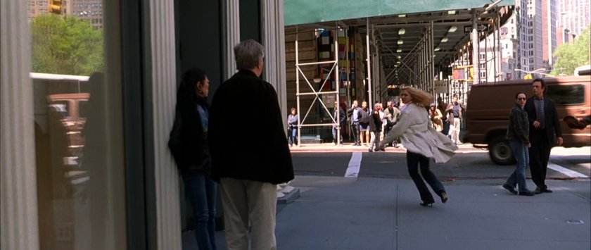 Sue running around a New York corner.