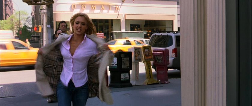 Sue running around a New York corner.