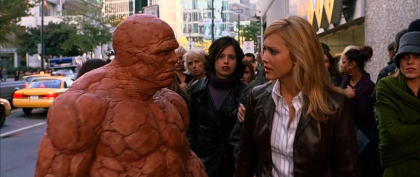 Ben and Sue walking along a crowded New York sidewalk.