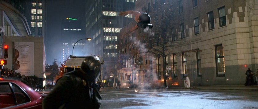 Doctor Doom throws The Thing through a New York intersection.