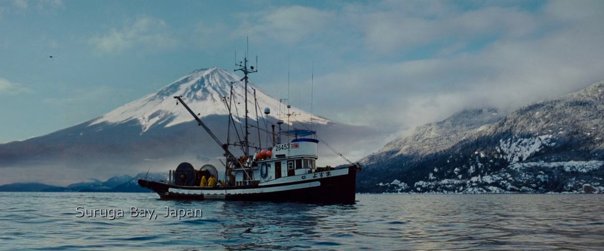 A Japanese fishing vessel on Suruga Bay. text: Suruga Bay, Japan.