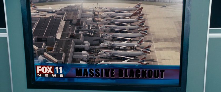 New report on television of a blackout, showing airplanes at a concourse.