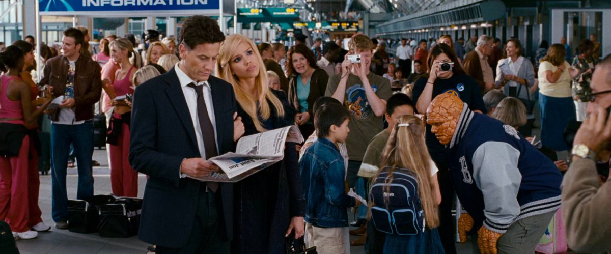 The Fantastic Four in a crowded airport.