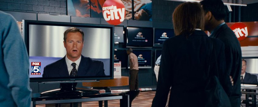 Reporter on television in a Circuit City store.