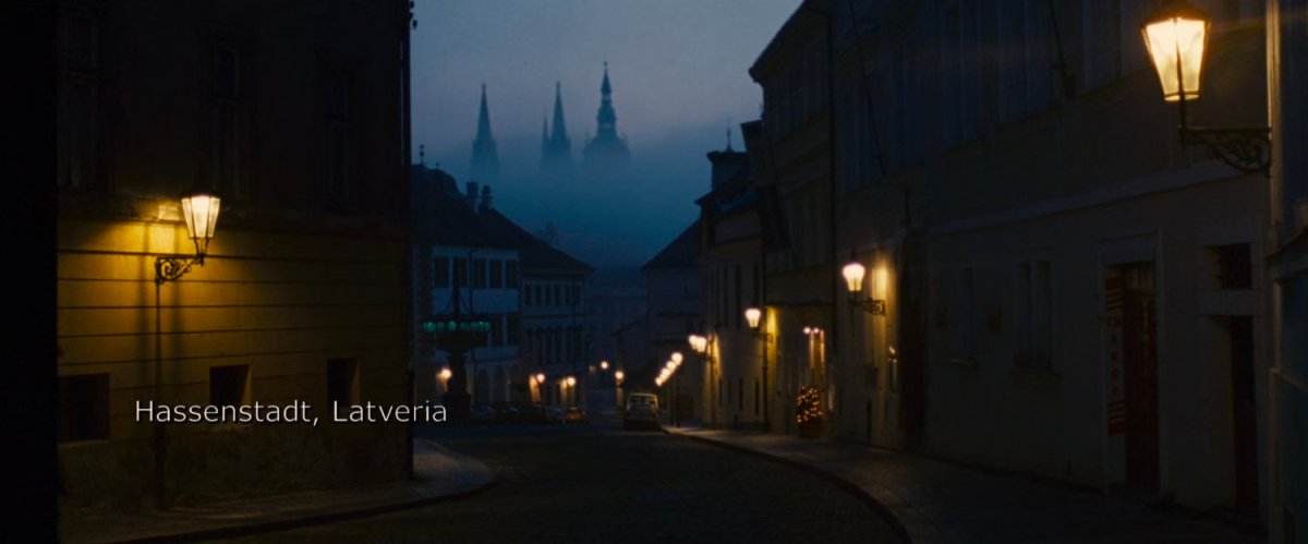 A foggy street in Latveria. Text: Hassenstadt, Latvera.