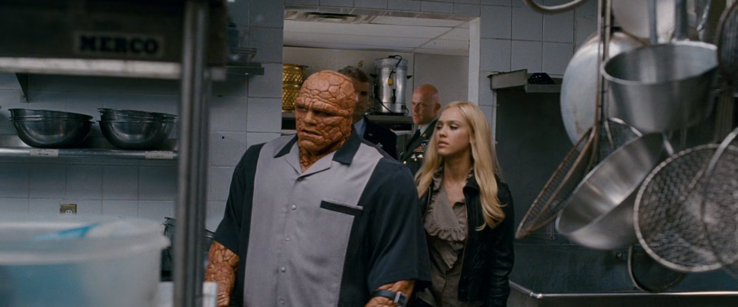 Ben and Sue entering a kitchen in a club.