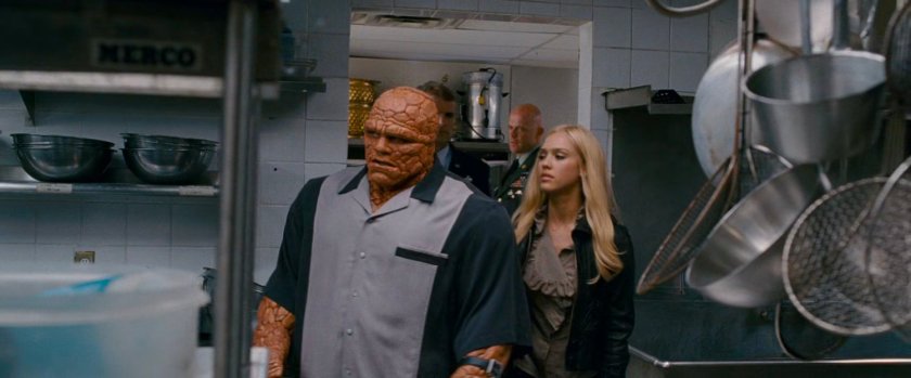 Ben and Sue entering a kitchen in a club.