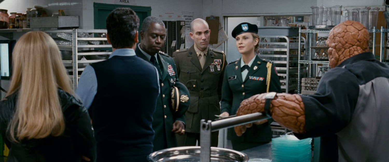 Reed, Ben, and Sue with General Hager and Captain Raye in a club's kitchen.