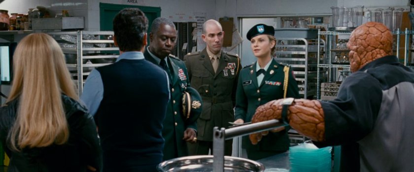 Reed, Ben, and Sue with General Hager and Captain Raye in a club's kitchen.