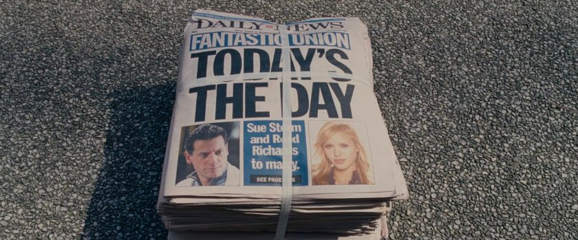 Closeup of newspaper bundle announcing the wedding of Reed and Sue.