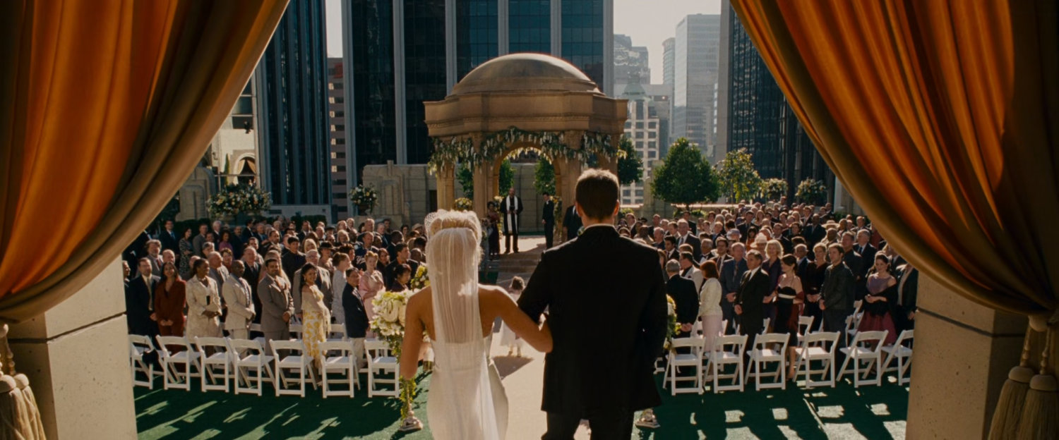 Johnny and Sue walking towards the alter on the rooftop of the Baxter Building.