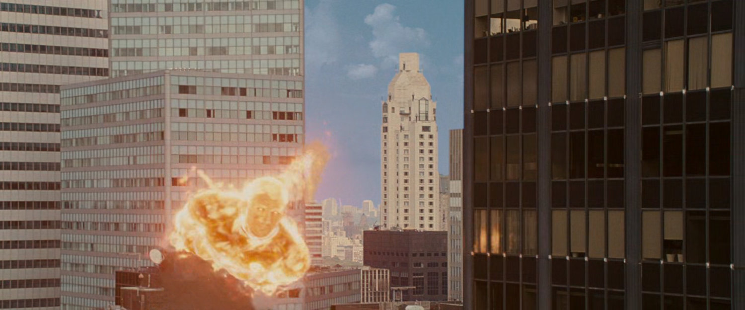 The Human Torch flying through the city.
