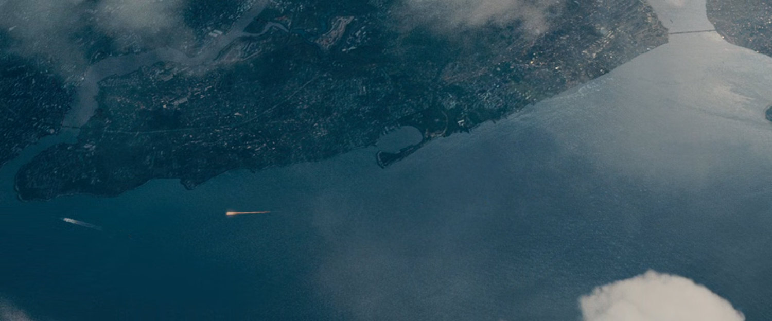The Human Torch chasing Silver Surfer in the sky above Staten Island.