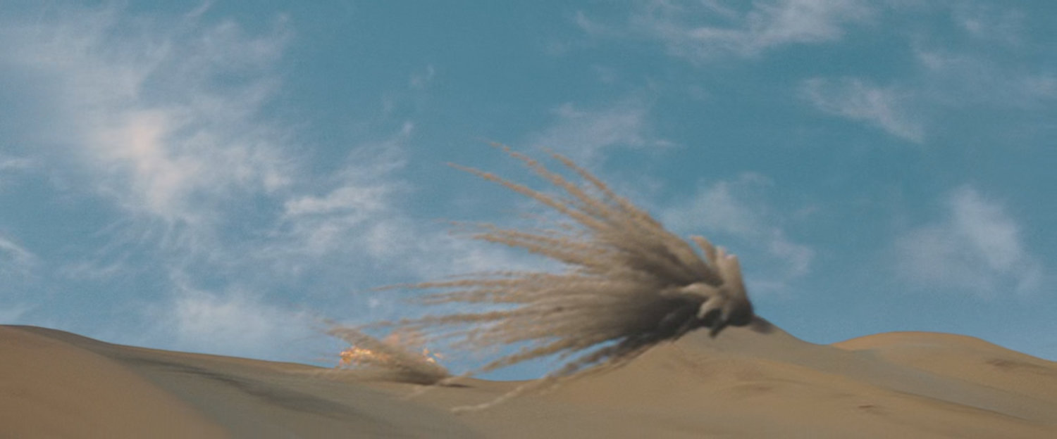 The Human Torch crashing into a sand dune.