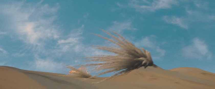 The Human Torch crashing into a sand dune.