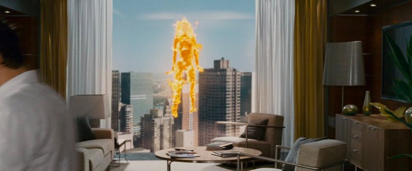 Sue, with Johnny's flame powers, outside a window of the Baxter Building.