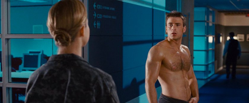 Captain Raye and Johnny in a hallway.