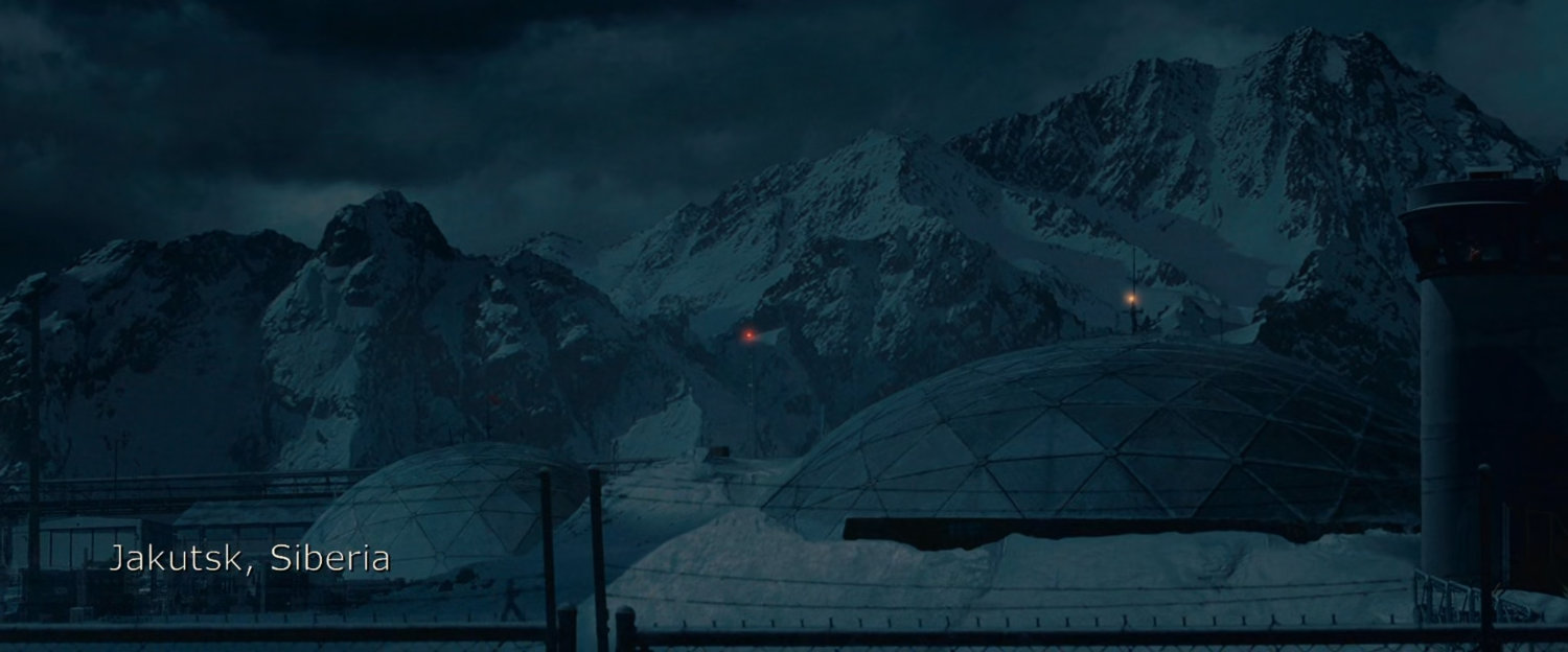 An army base by snowy mountains. Text: Jakutsk, Siberia.