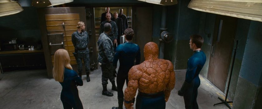 The Fantastic Four with General Hager in a room at Inyeptuk Station.