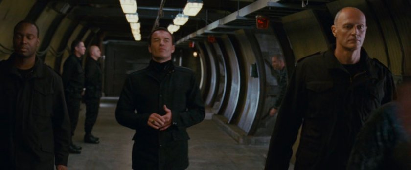 Victor and other men in a hallway at Inyeptuk Station.