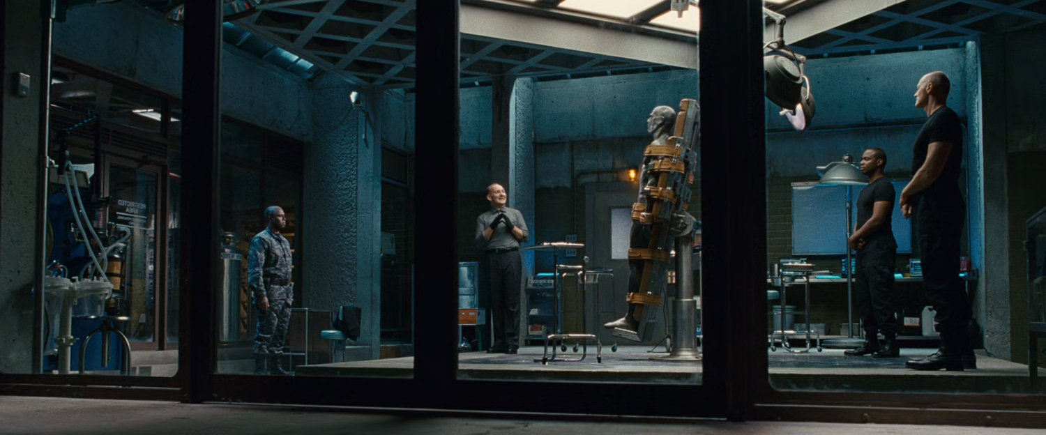 General Hager in an operating room at Inyeptuk Station with other men and the unconscious Silver Surfer.