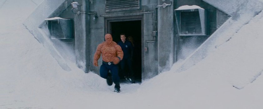 Ben and Johnny exit a door at Inyeptuk Station.