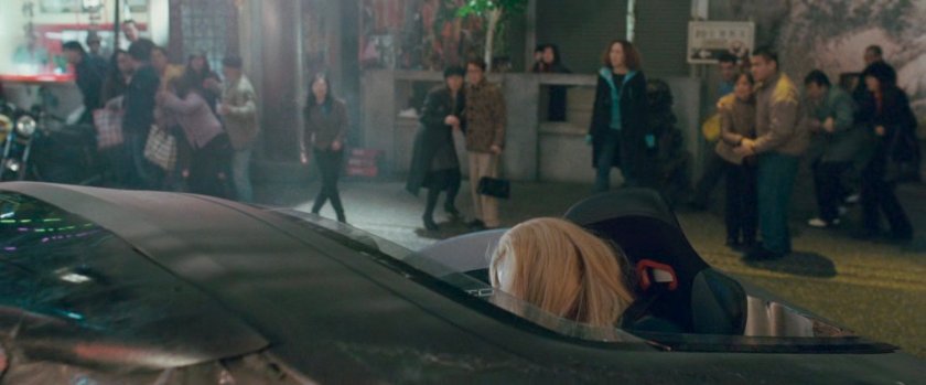 Sue in a crashed Fantasticar pod on a Shanghai street.