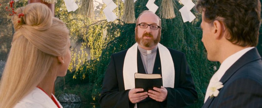 Reed, Sue and a preacher at an outdoor Japanese temple.