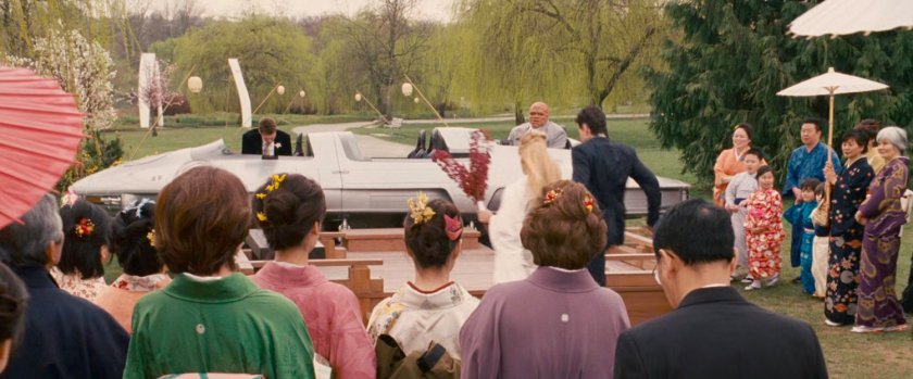 The Fantastic Four get into the Fantasticar outside a Japanese temple.