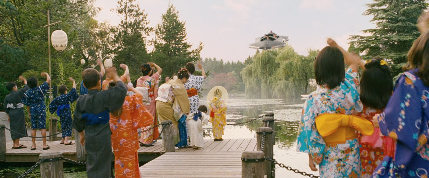 Japanese citizens wave at the departing Fantasticar.