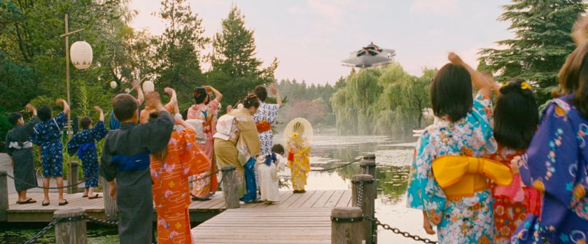 Japanese citizens wave at the departing Fantasticar.