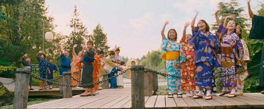 Japanese citizens wave at the departing Fantasticar.