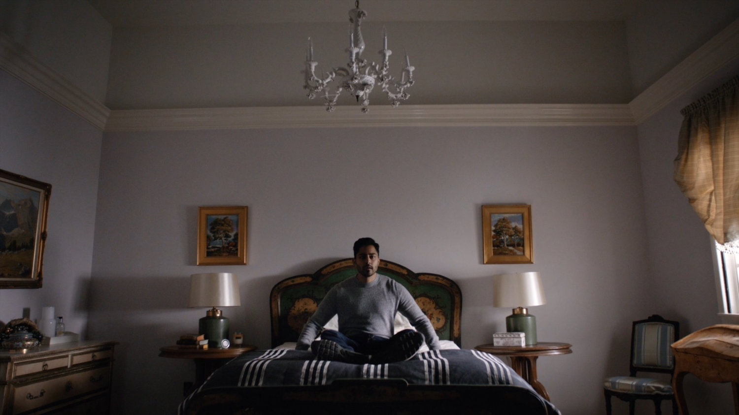 Vijay wakes up in his sister's lake house.