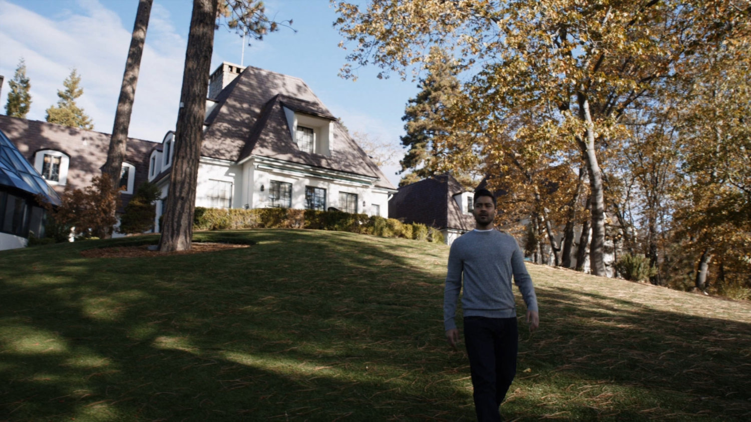 Vijay on the lawn outside his sister's lake house.
