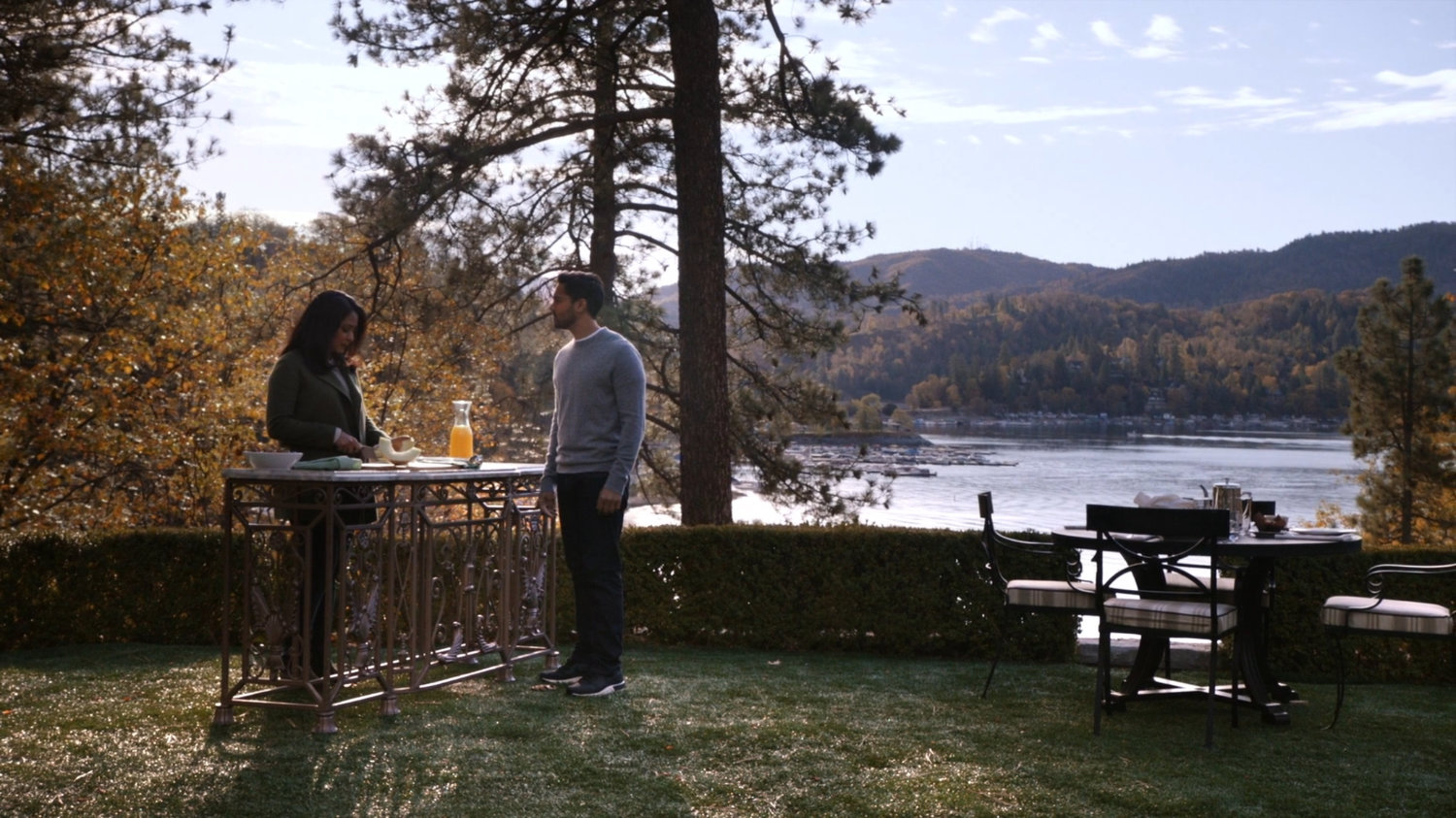 Vijay and Ellen on the lawn outside her lake house.