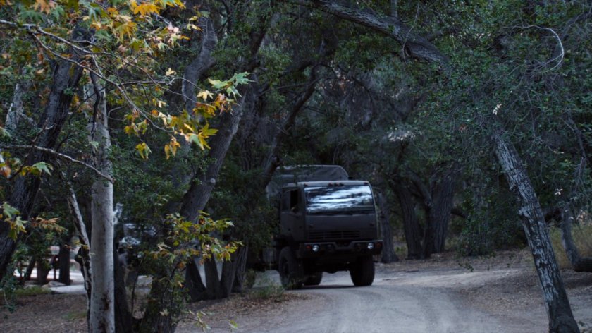 Troop transport driving along road in Freyer National Park West Virginia.