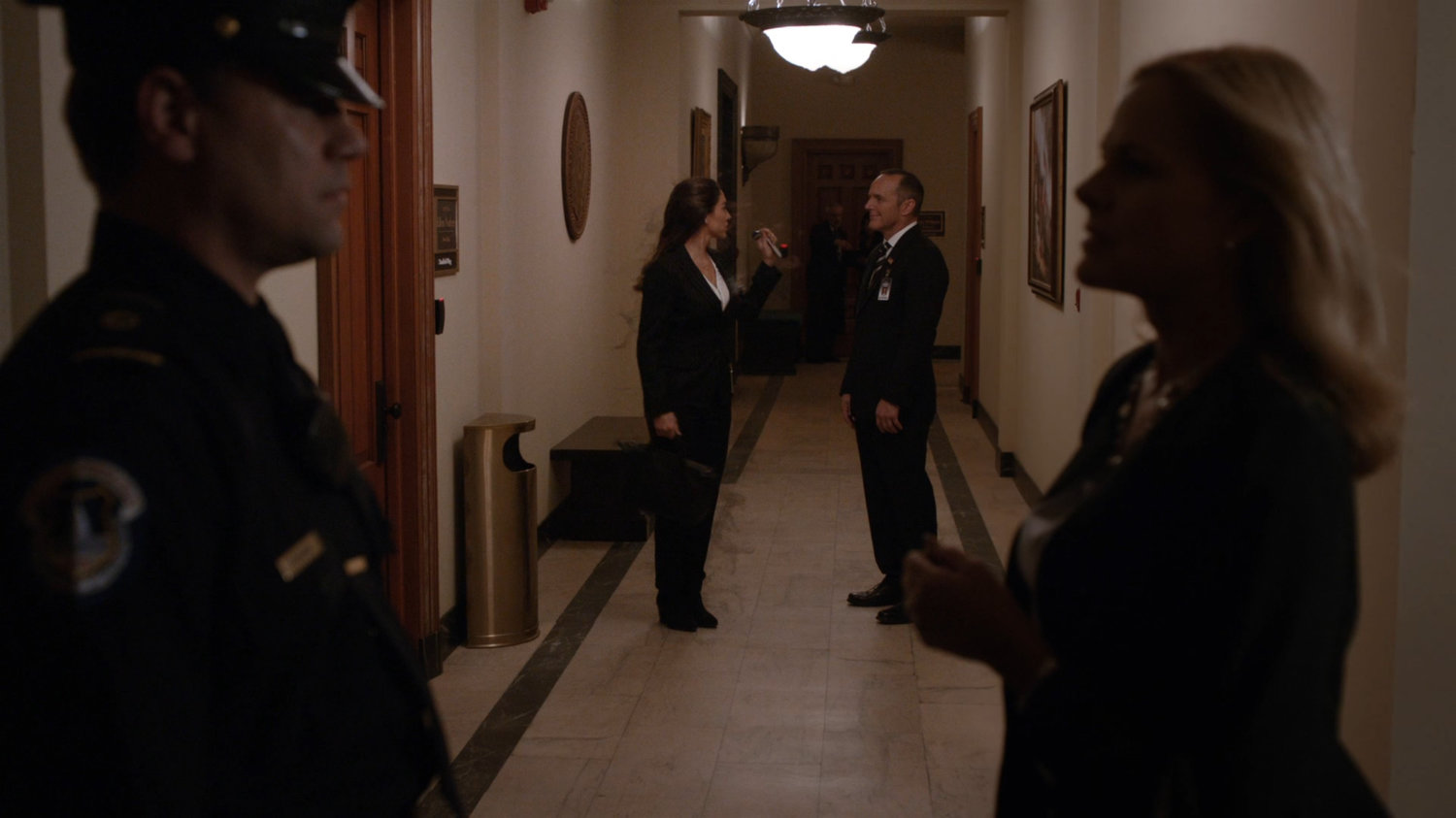 Coulson and Yo-Yo in a Senate hallway.