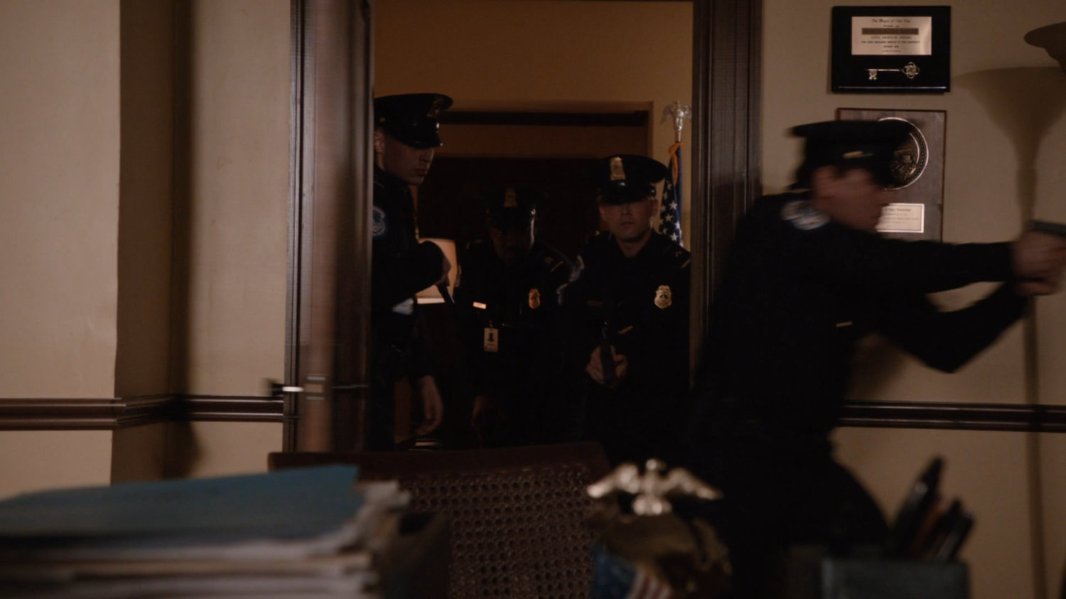 Police officers enter Ellen Nadeer's Senate office.