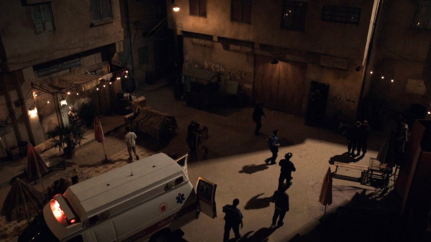 Nigh angle view of ambulance and SHIELD agents in a courtyard in Bahrain.