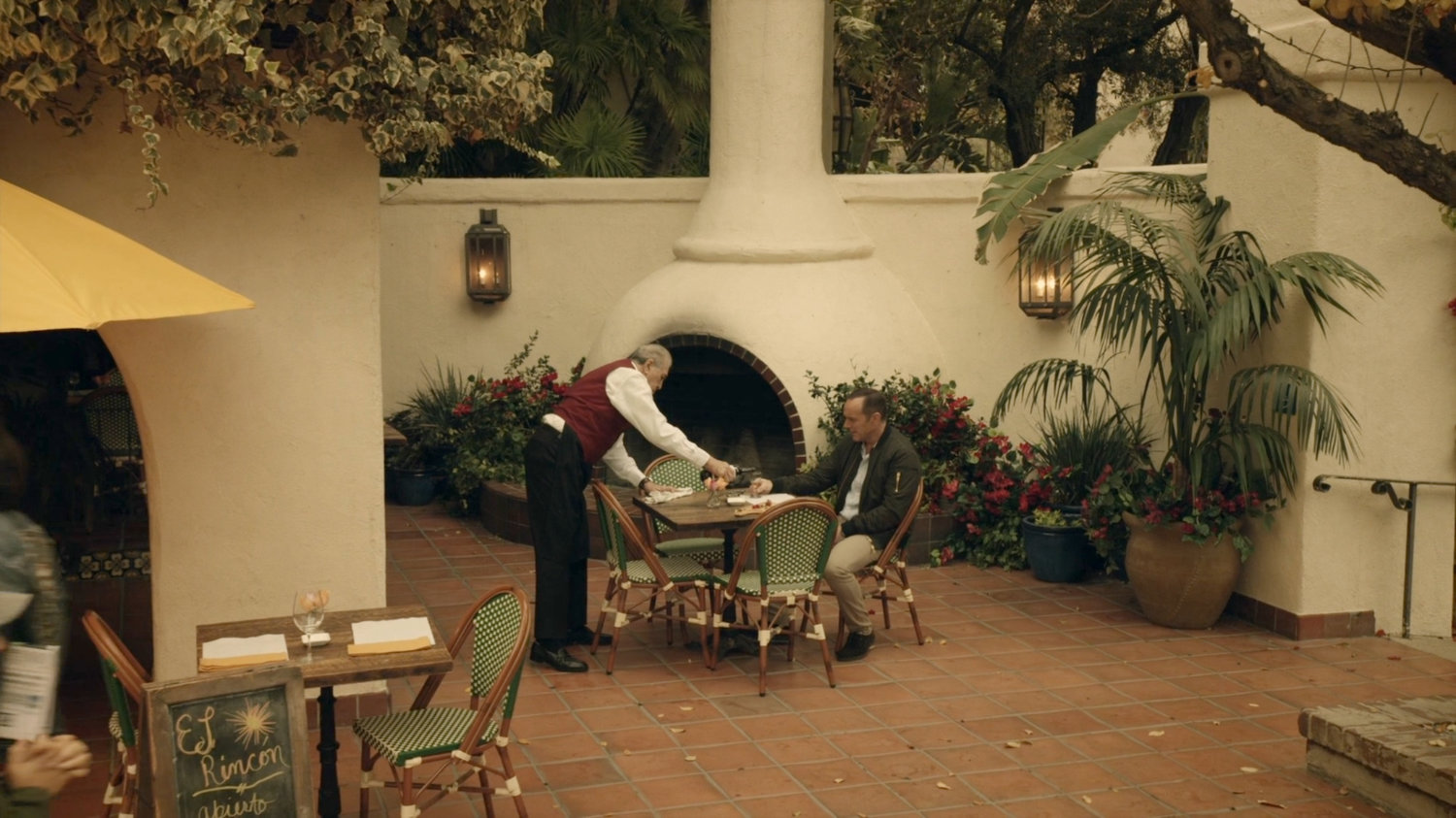 Coulson at a dining table in Spanish Plaza.